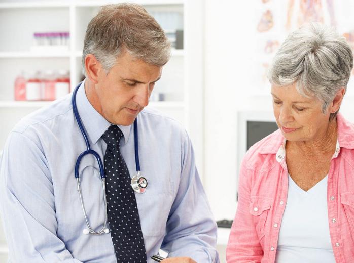 woman speaking to doctor