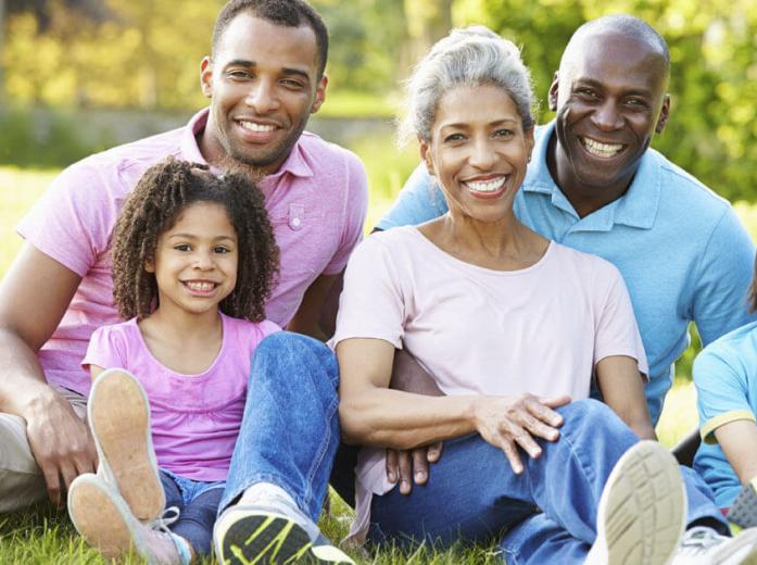 family of 4 smiling